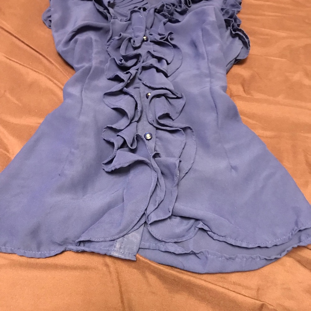 Blue shirt with buttons.